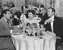 Scene with Mario Lanza and David Niven with Bess Flowers in the background